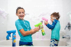 Two boys spraying Fozzi's Foam Soap Spray in the bathtub having a lot of fun!